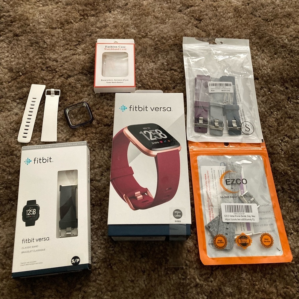 Rose Gold Fitbit Versa with Accessories all in excellent condition